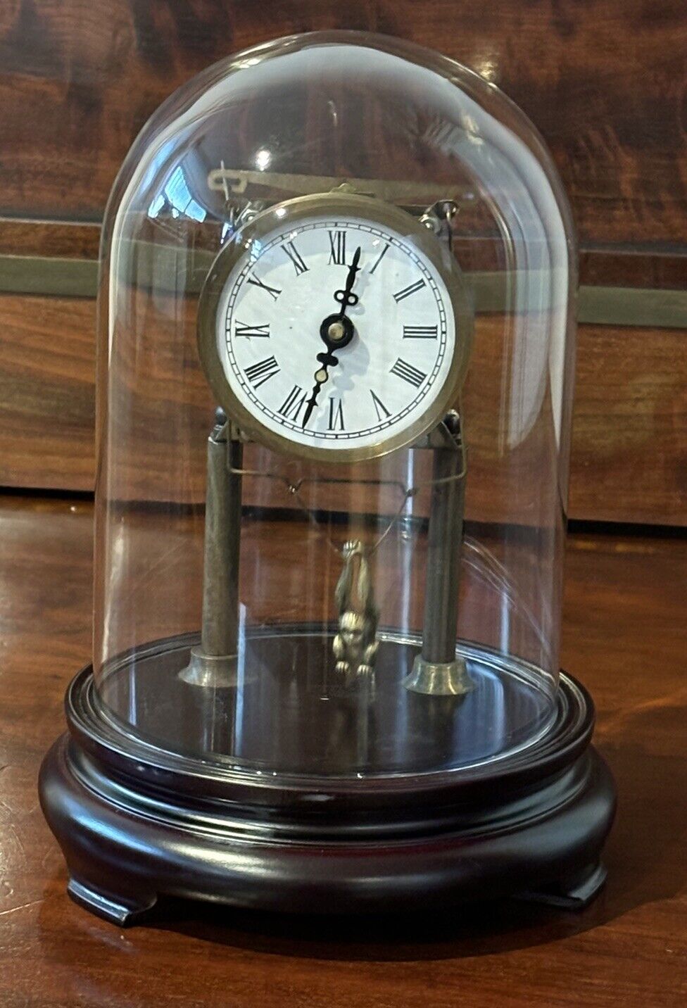 Skeleton Clock In Case With Swinging Monkey Pendulum.