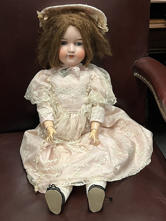 Armand Marseille bisque headed doll 390 with impressed marks to head, 68cm.