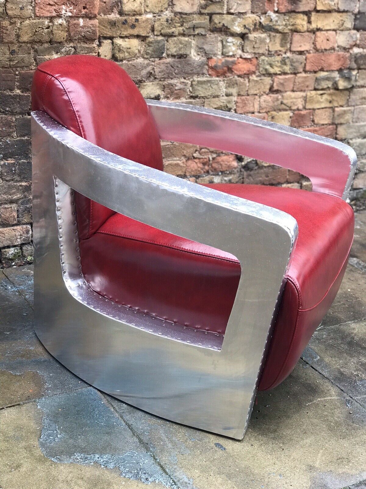 Aviators Armchair, Aluminium With Red Leather Upholstery.