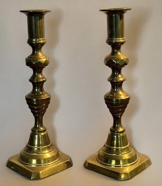 Antique Brass Candlesticks. 22.5 cms tall. With working candle pushers