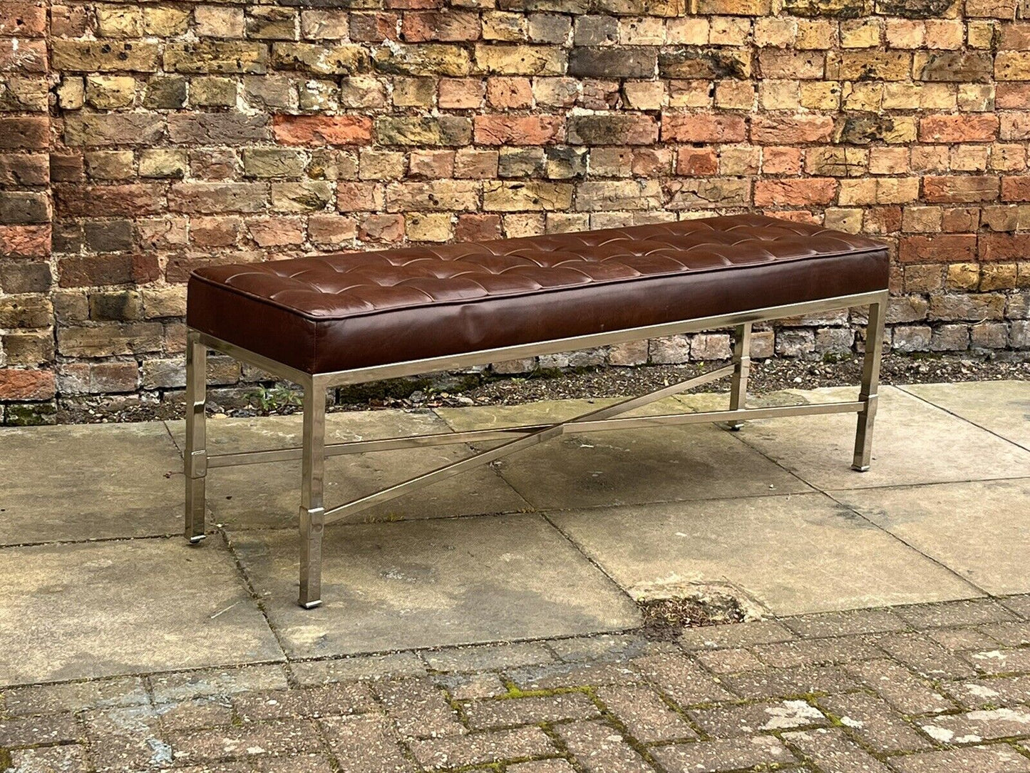 Tan Leather Designer Stool With chrome Legs.