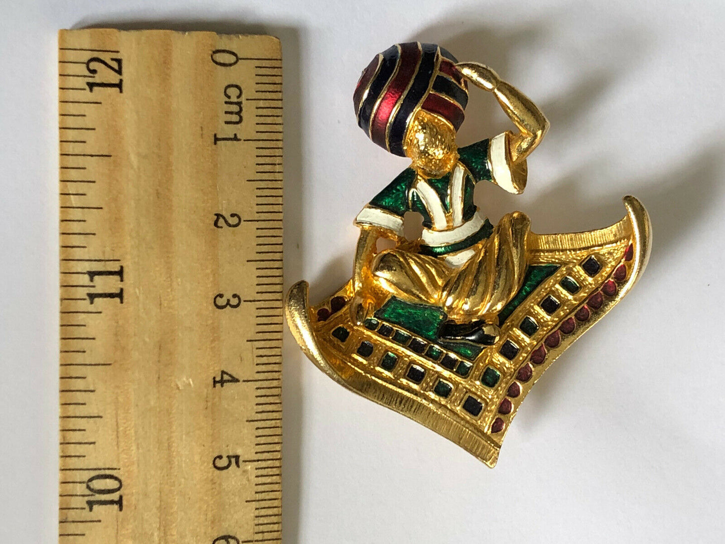 Vintage Gold Tone Enamelled Man On Flying Carpet