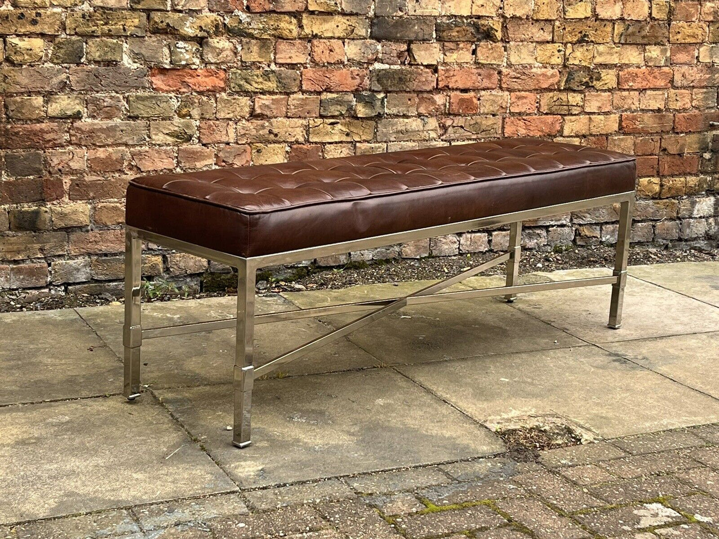 Tan Leather Designer Stool With chrome Legs.