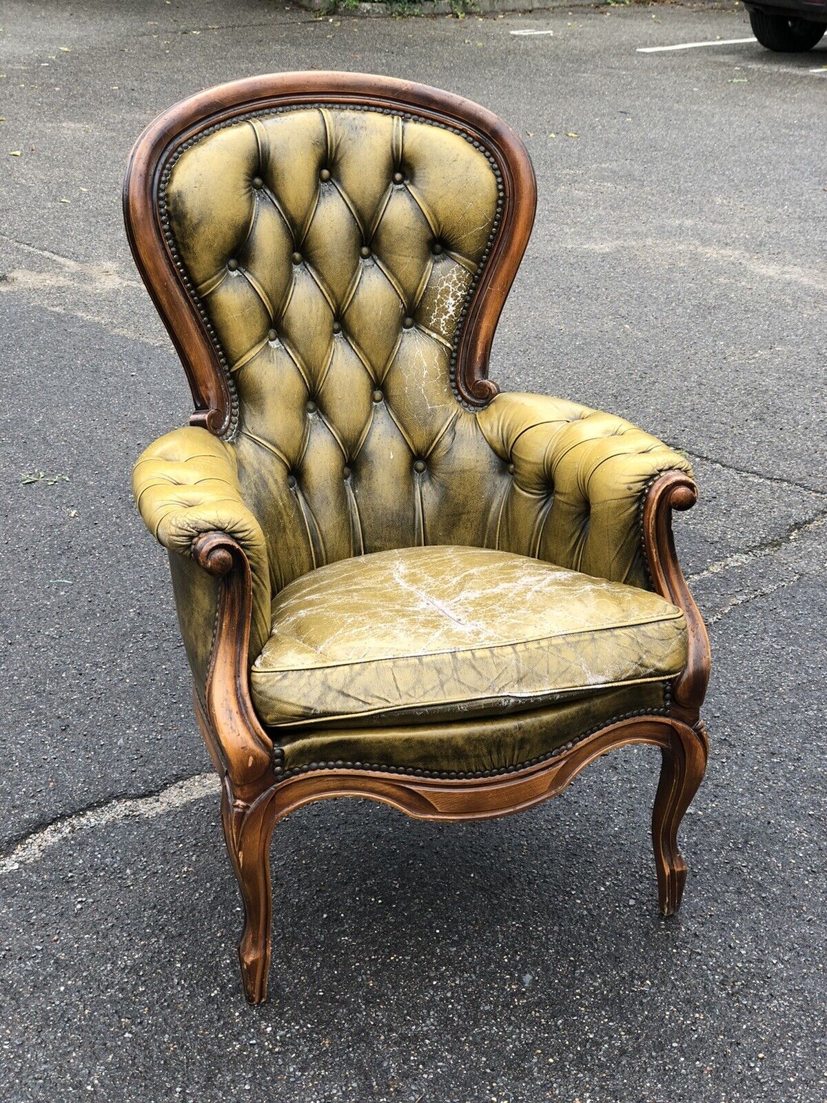 Green Leather Buttoned Back Armchair.