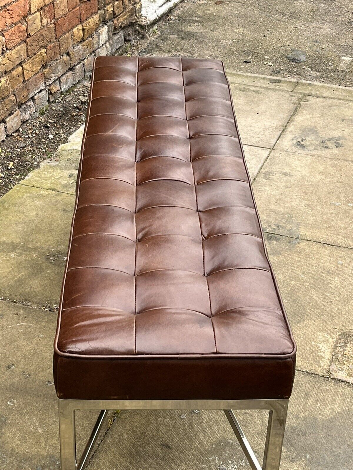 Tan Leather Designer Stool With chrome Legs.