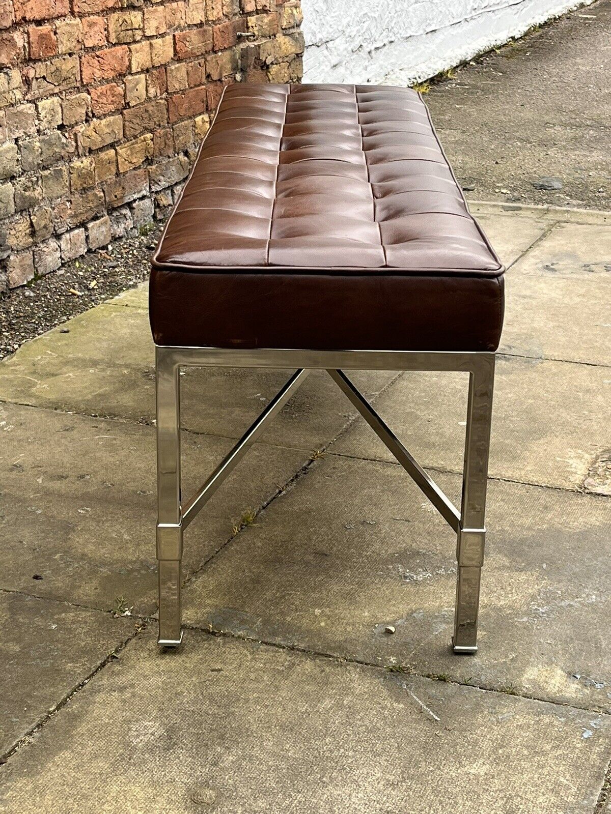 Tan Leather Designer Stool With chrome Legs.